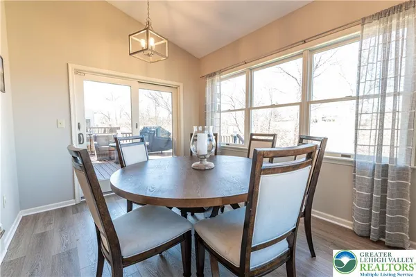 a living room with furniture dining table and a fireplace