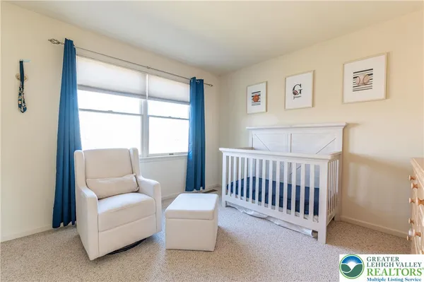 a spacious bedroom with a bed and a couch