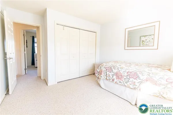 a bedroom with a bed and a cabinets