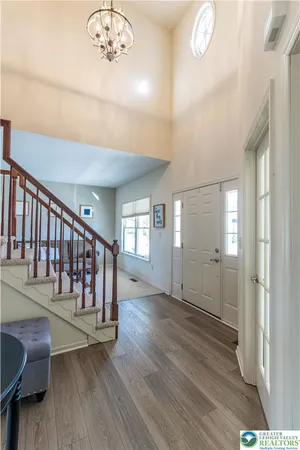 a view of entryway with wooden floor