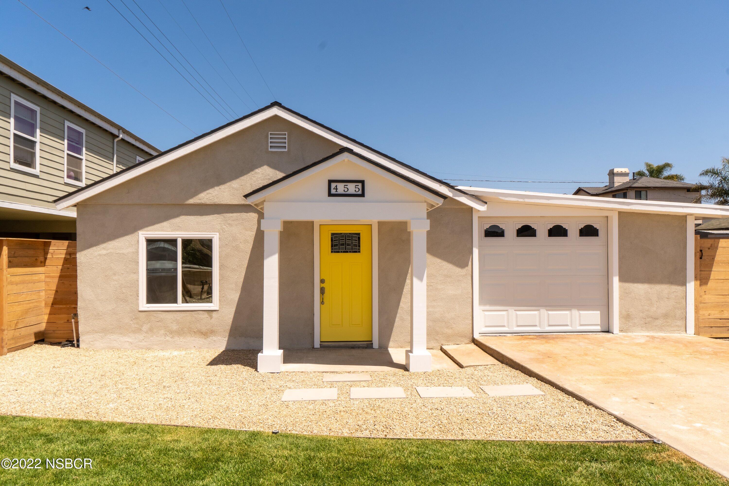 455 Longbranch Avenue Grover Beach, CA 93433 - Photo 1 of 23 a front view of a house with a outdoor space
