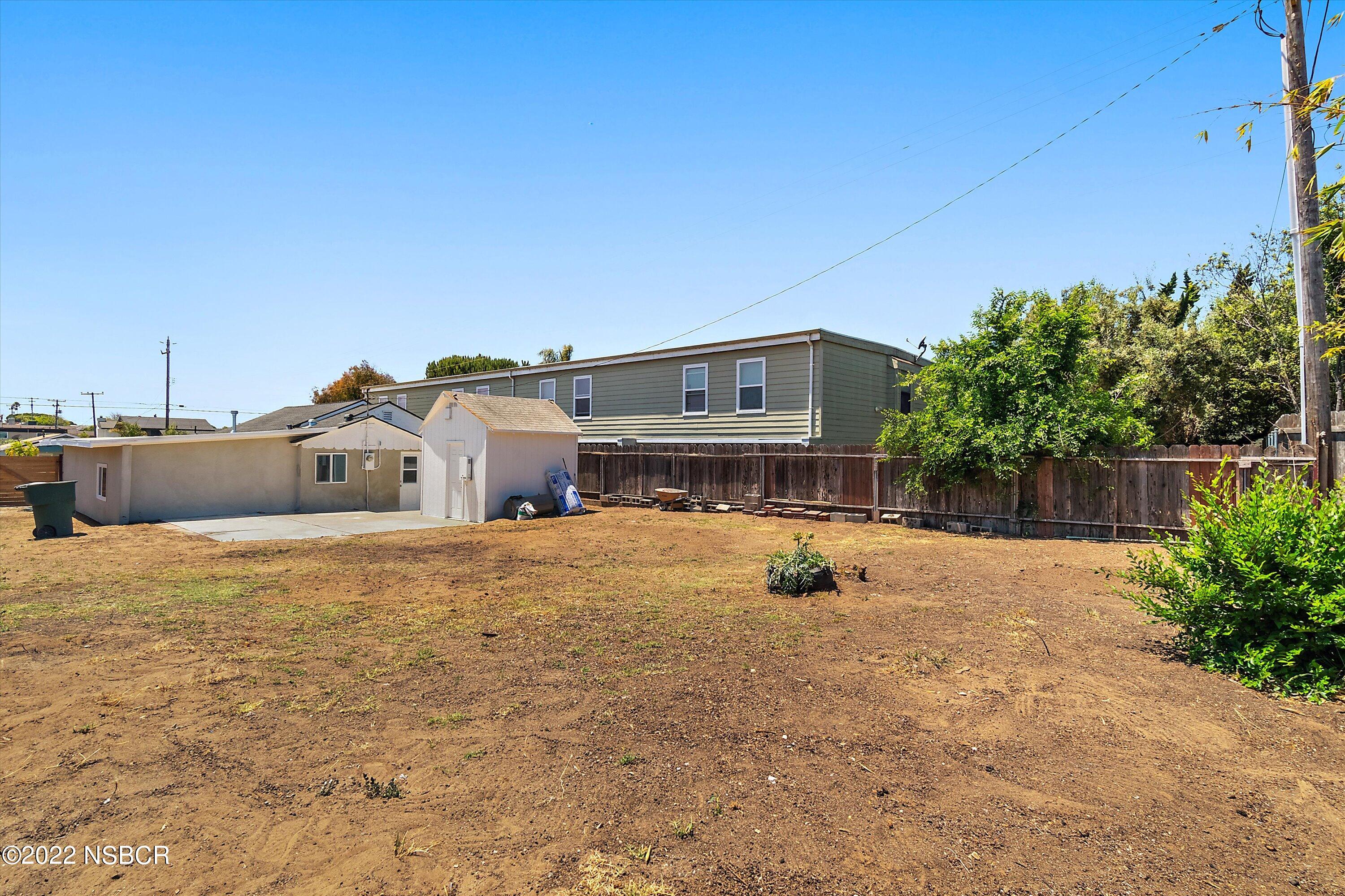 455 Longbranch Avenue Grover Beach, CA 93433 - Photo 22 of 23 a view of a house with a backyard