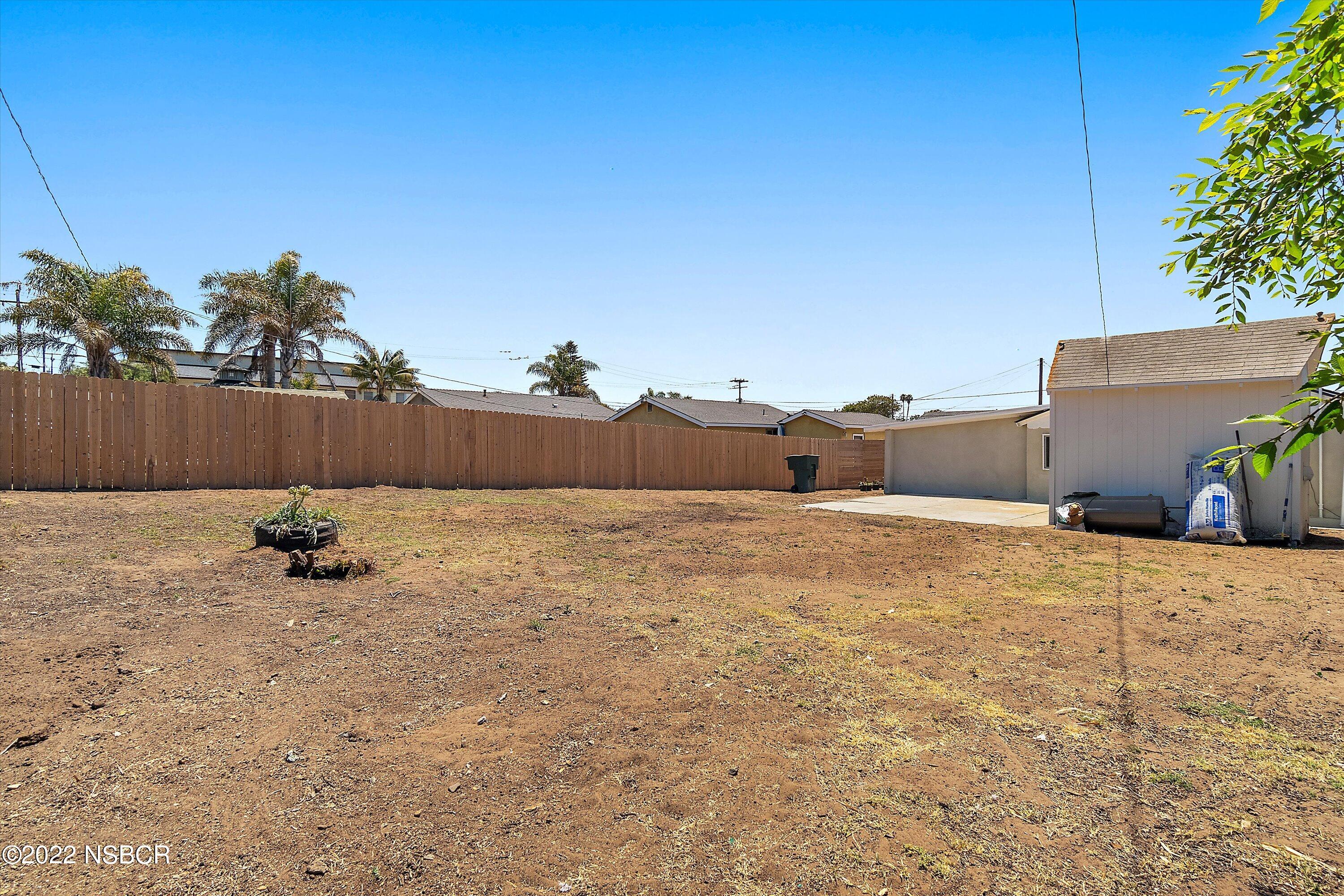 455 Longbranch Avenue Grover Beach, CA 93433 - Photo 23 of 23 a backyard of a house with lots of green space