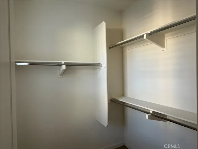 a view of empty room with ceiling fan