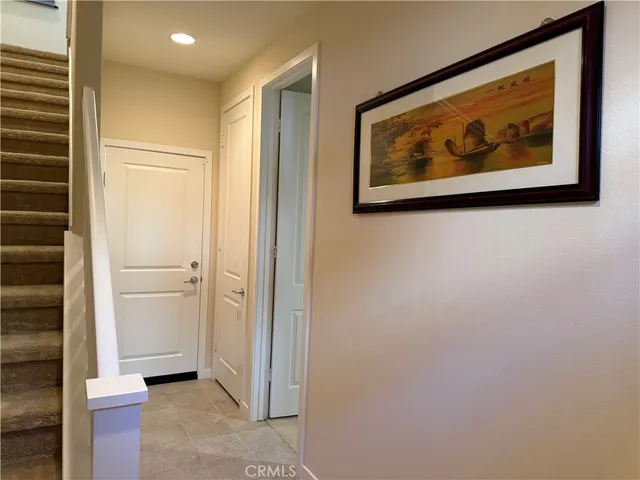 a view of a hallway with paintings on the wall