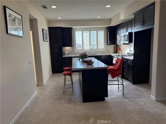 a living room with furniture and a rug