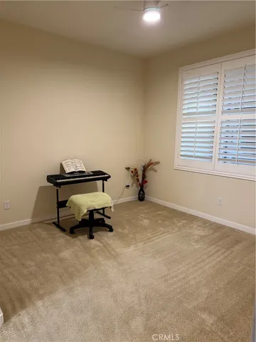 a view of a porch with furniture and stairs