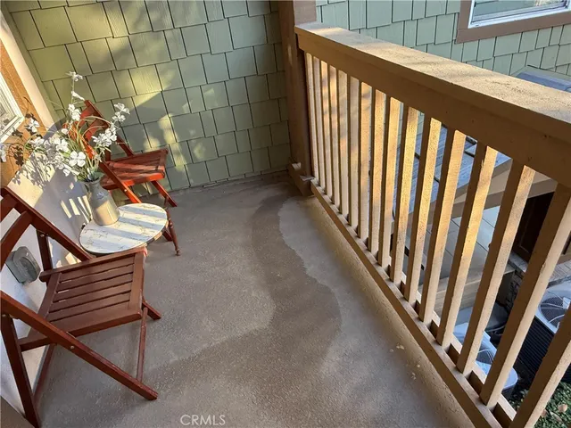 a living room with furniture a rug and a fireplace