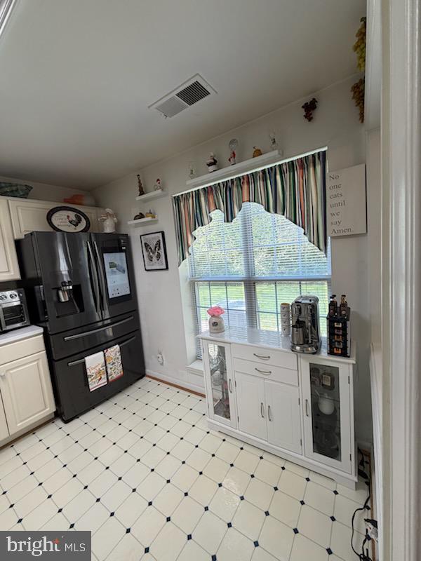 46891 Eaton Terrace, Unit 101 Sterling, VA 20164 - Photo 14 of 41 a bedroom with furniture a window and dresser