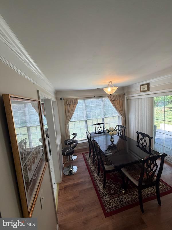 46891 Eaton Terrace, Unit 101 Sterling, VA 20164 - Photo 15 of 41 a living room with furniture and a wooden floor