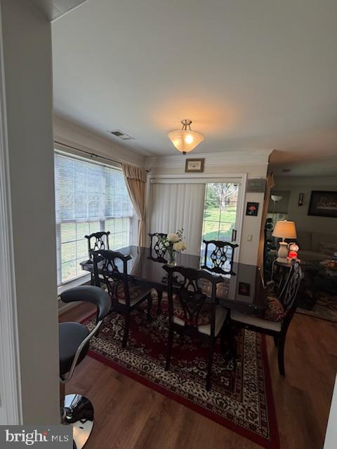 46891 Eaton Terrace, Unit 101 Sterling, VA 20164 - Photo 19 of 41 a view of a dining room with furniture window and wooden floor