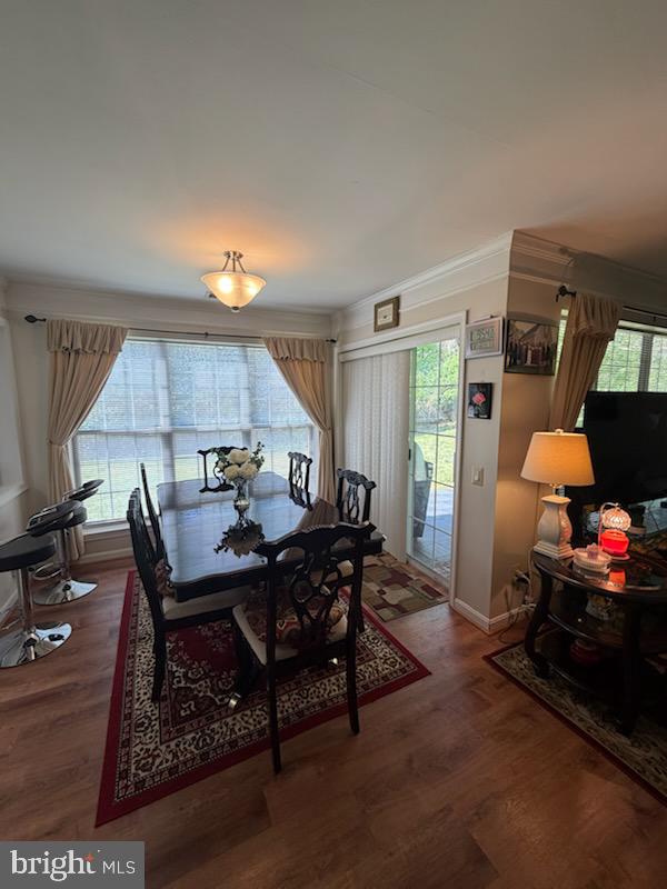46891 Eaton Terrace, Unit 101 Sterling, VA 20164 - Photo 21 of 41 a living room with furniture a window and a table