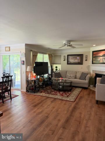46891 Eaton Terrace, Unit 101 Sterling, VA 20164 - Photo 23 of 41 a living room with furniture and a flat screen tv