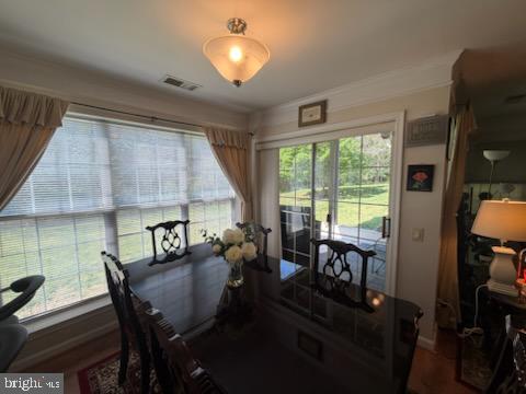 46891 Eaton Terrace, Unit 101 Sterling, VA 20164 - Photo 26 of 41 a dining room with furniture and large windows