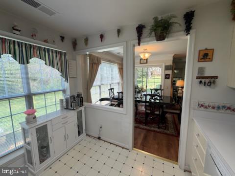 46891 Eaton Terrace, Unit 101 Sterling, VA 20164 - Photo 28 of 41 a kitchen with stainless steel appliances kitchen island granite countertop a refrigerator and a sink