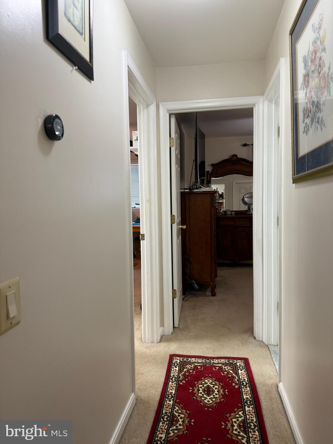46891 Eaton Terrace, Unit 101 Sterling, VA 20164 - Photo 7 of 41 a view of hallway with closet and a rug