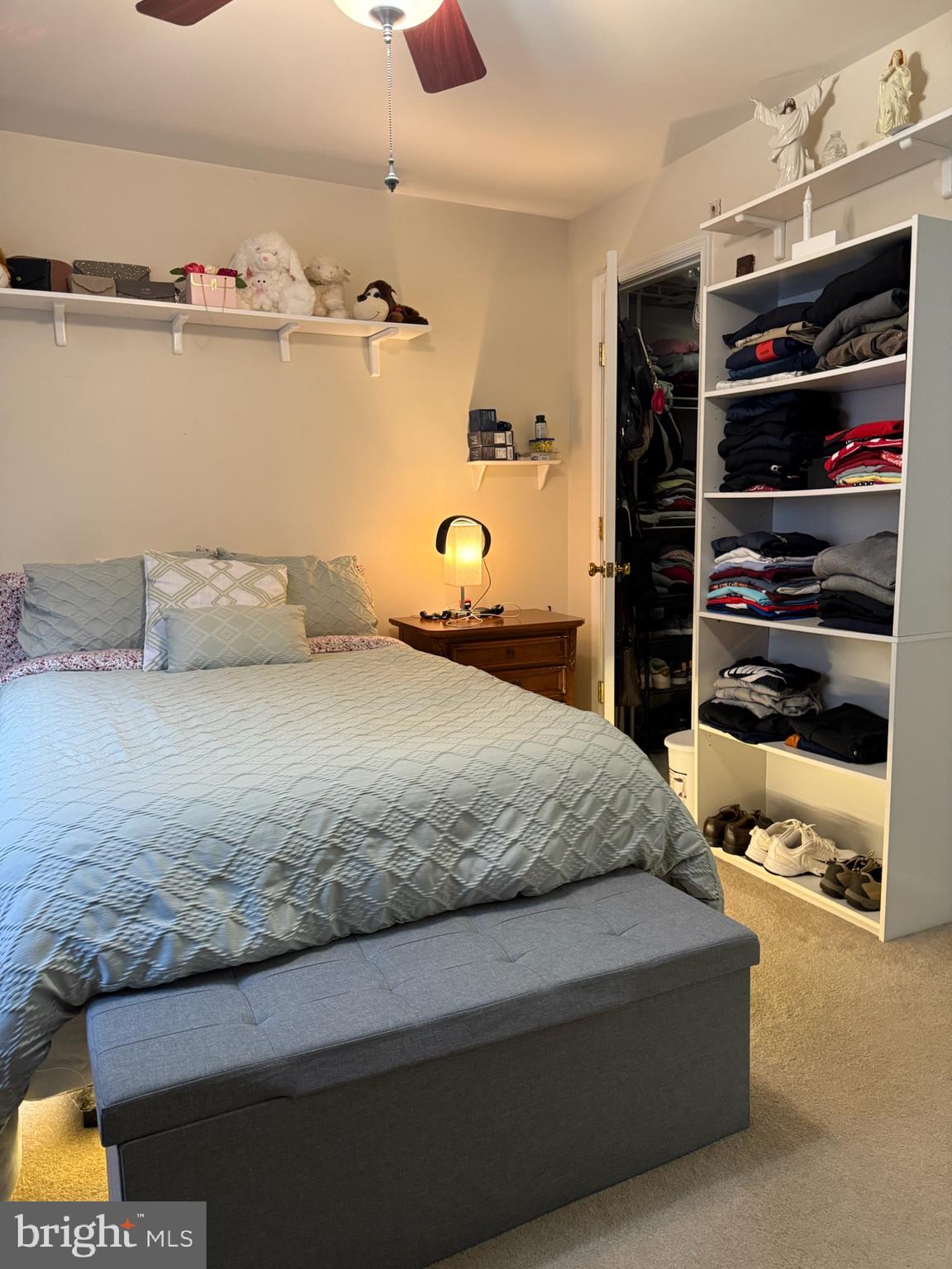 46891 Eaton Terrace, Unit 101 Sterling, VA 20164 - Photo 8 of 41 a bedroom with a bed and a television