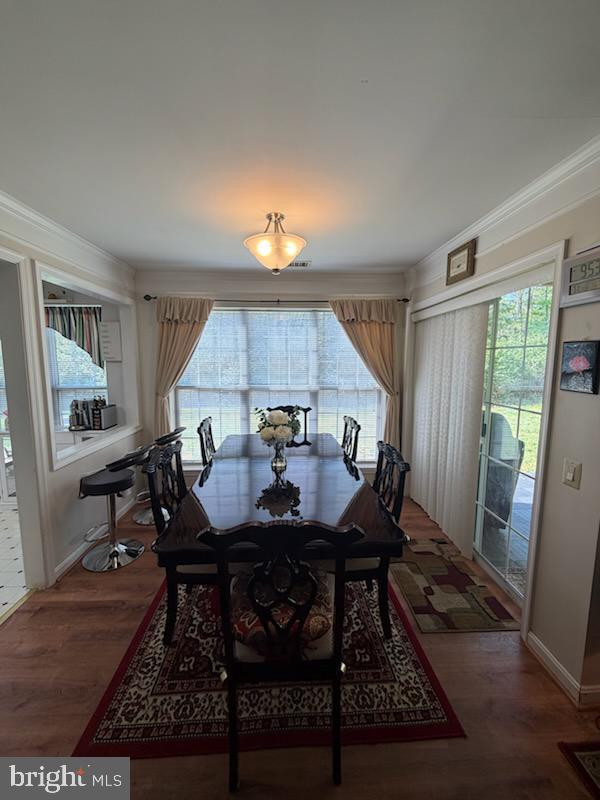 46891 Eaton Terrace, Unit 101 Sterling, VA 20164 - Photo 10 of 41 a view of a dining room with furniture and window