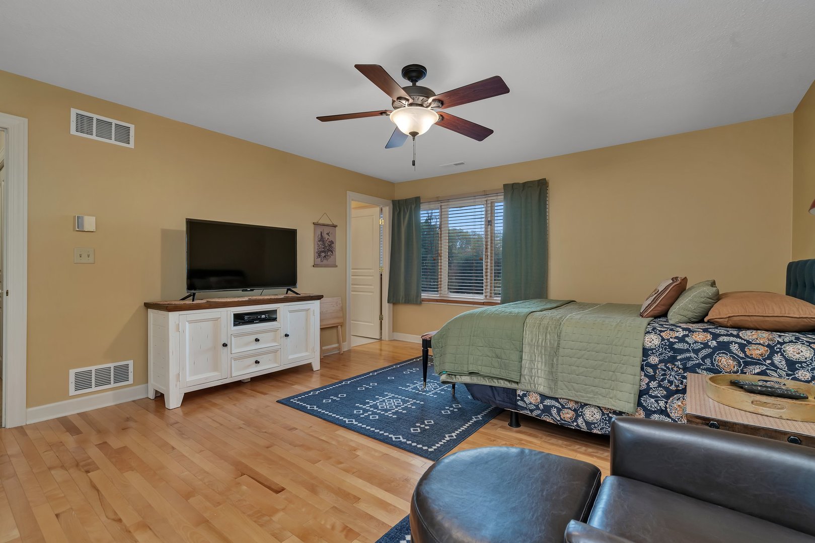 727 South Raven Road Shorewood, IL 60404 - Photo 24 of 36 a bedroom with furniture and a flat screen tv