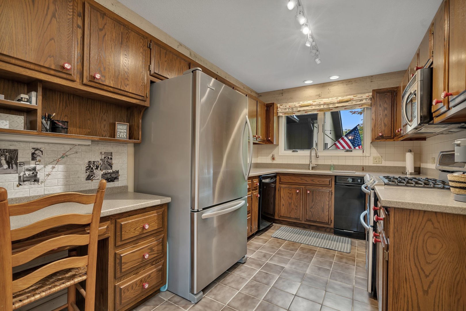 727 South Raven Road Shorewood, IL 60404 - Photo 5 of 36 a kitchen with stainless steel appliances granite countertop a sink stove and refrigerator