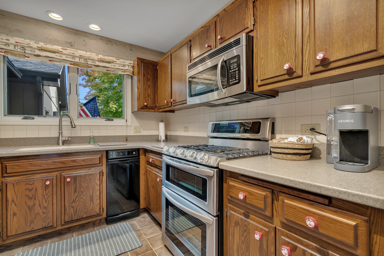 727 South Raven Road Shorewood, IL 60404 - Photo 6 of 36 a kitchen with stainless steel appliances granite countertop a sink stove and microwave