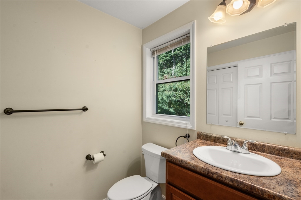 190 Old Road Dracut, MA 01826 - Photo 11 of 36 a bathroom with a granite countertop sink and a mirror