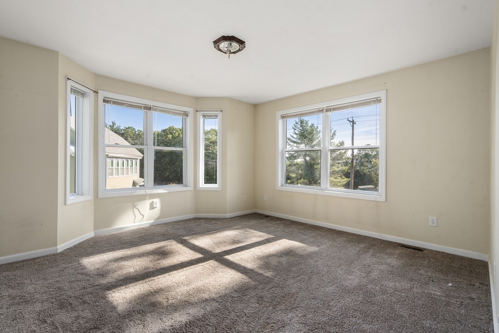 190 Old Road Dracut, MA 01826 - Photo 13 of 36 a view of an empty room with a window