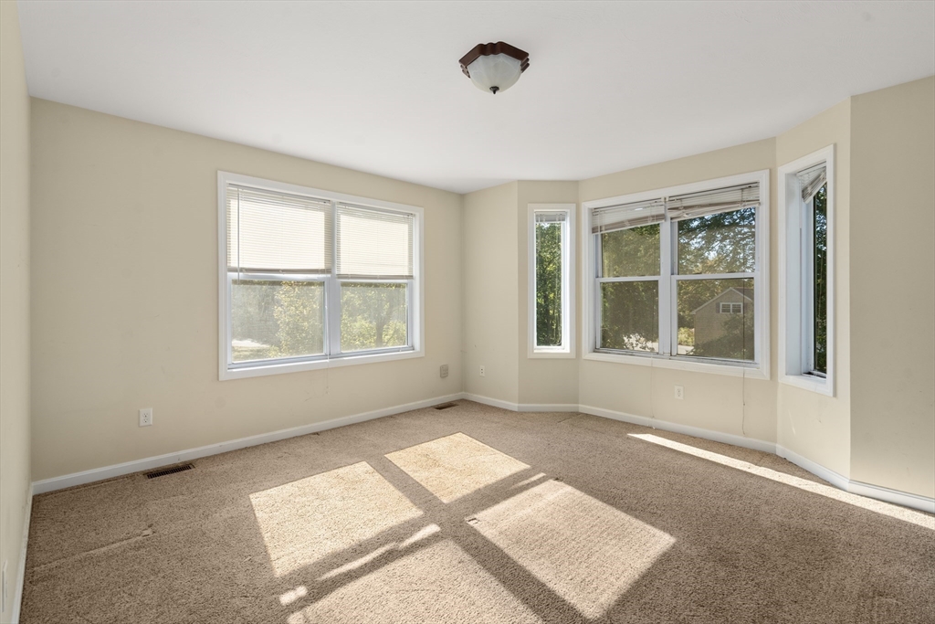 190 Old Road Dracut, MA 01826 - Photo 18 of 36 a view of an empty room with windows