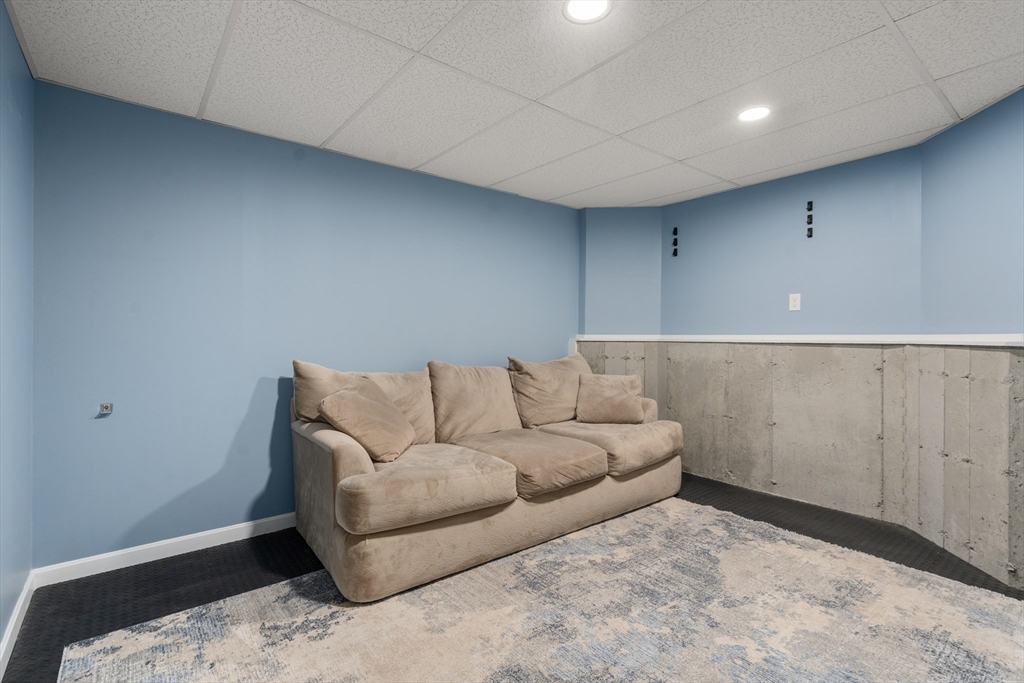 190 Old Road Dracut, MA 01826 - Photo 22 of 36 a living room with a couch