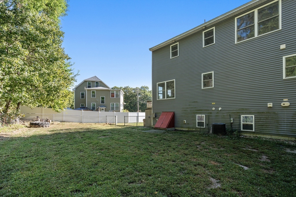 190 Old Road Dracut, MA 01826 - Photo 25 of 36 a front view of house with yard and green space