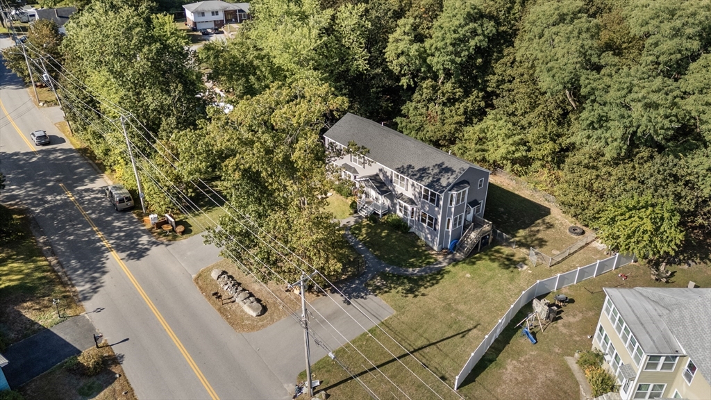 190 Old Road Dracut, MA 01826 - Photo 34 of 36 a view of a wooden house with large trees