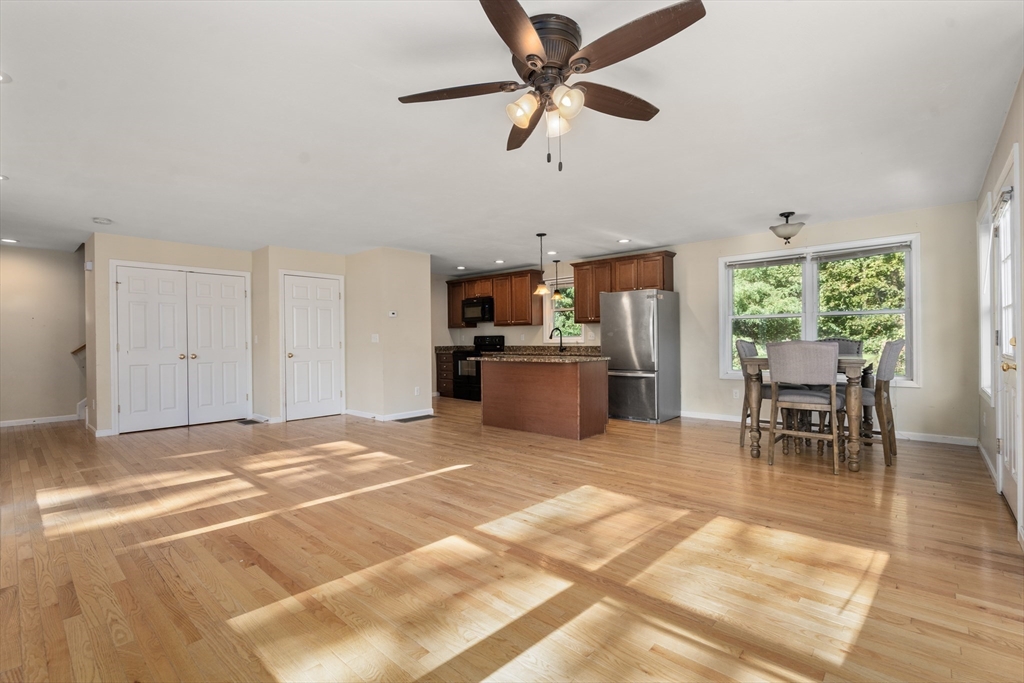 190 Old Road Dracut, MA 01826 - Photo 8 of 36 a view of a livingroom with furniture and a kitchen