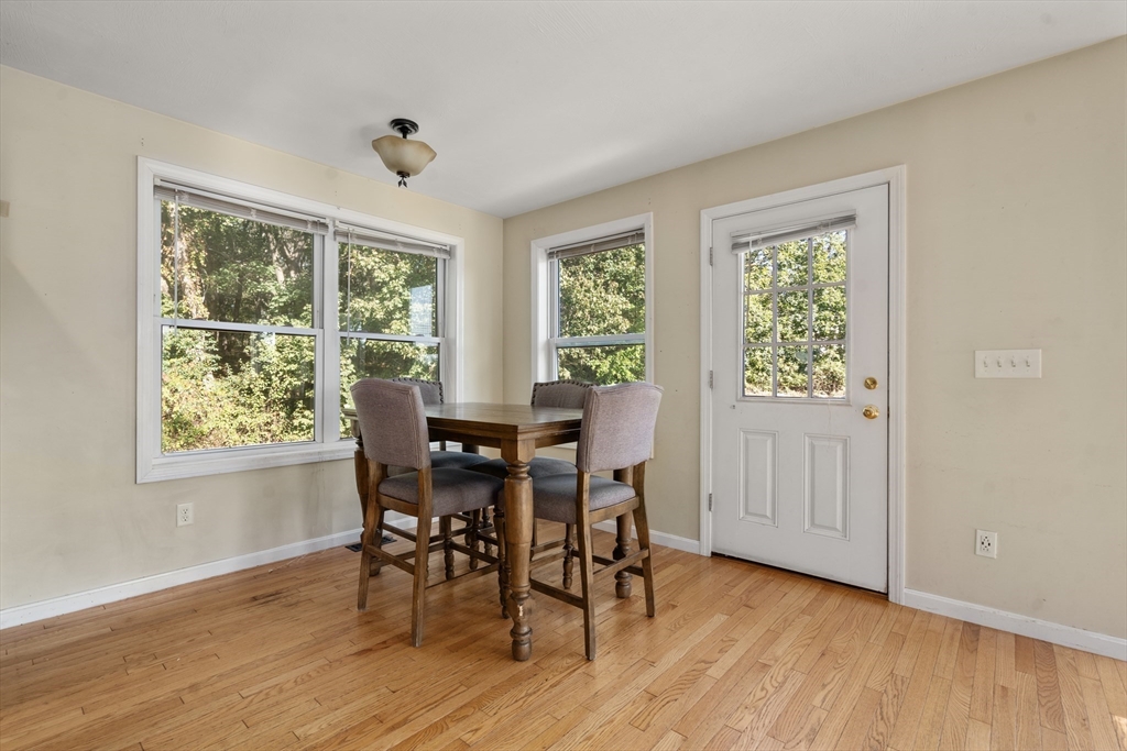 190 Old Road Dracut, MA 01826 - Photo 10 of 36 a view of a dining room with furniture and wooden floor