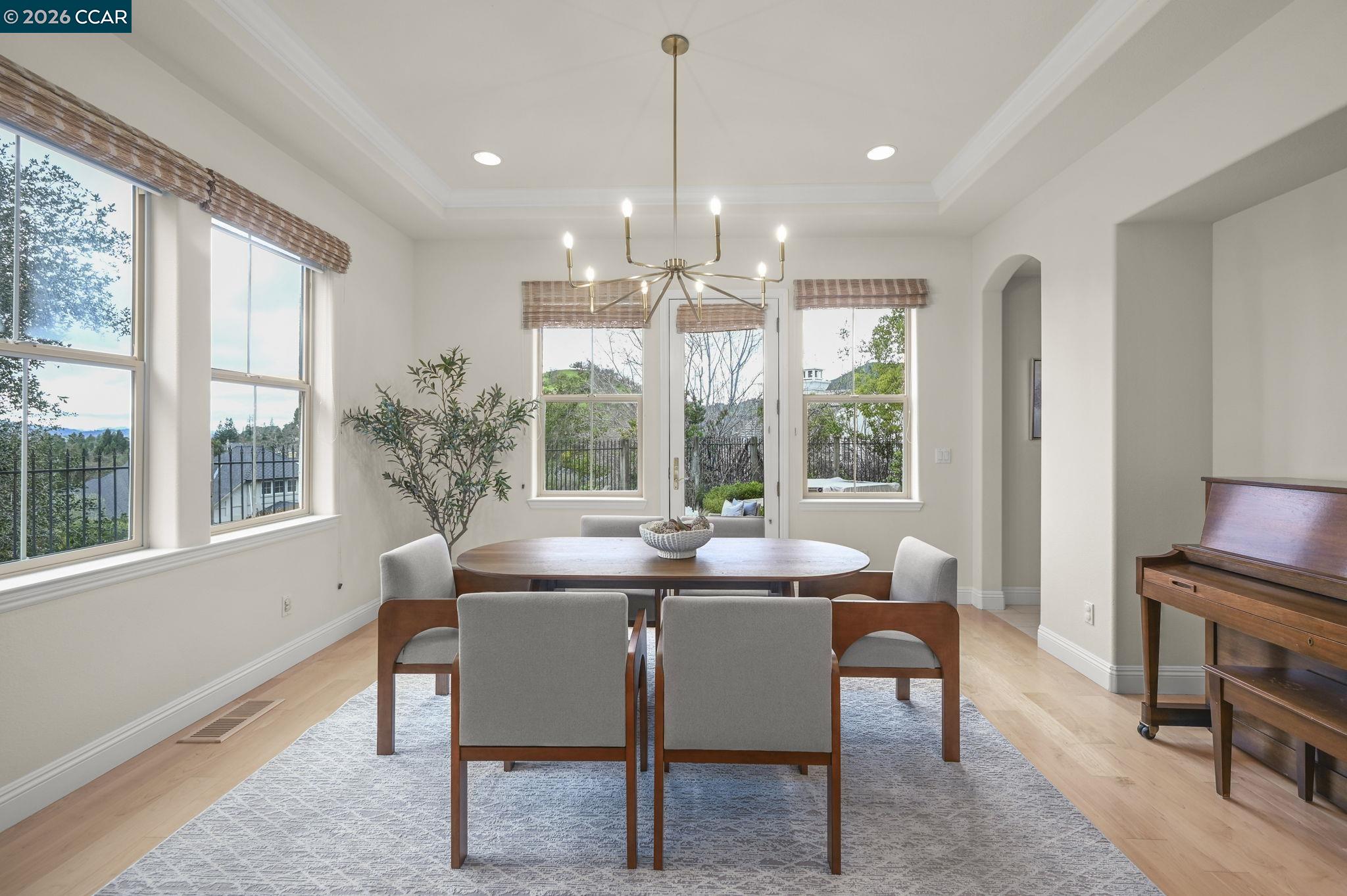 135 Diablo Ranch Court Danville, CA 94506 - Photo 19 of 60 a dining room with furniture a chandelier and wooden floor