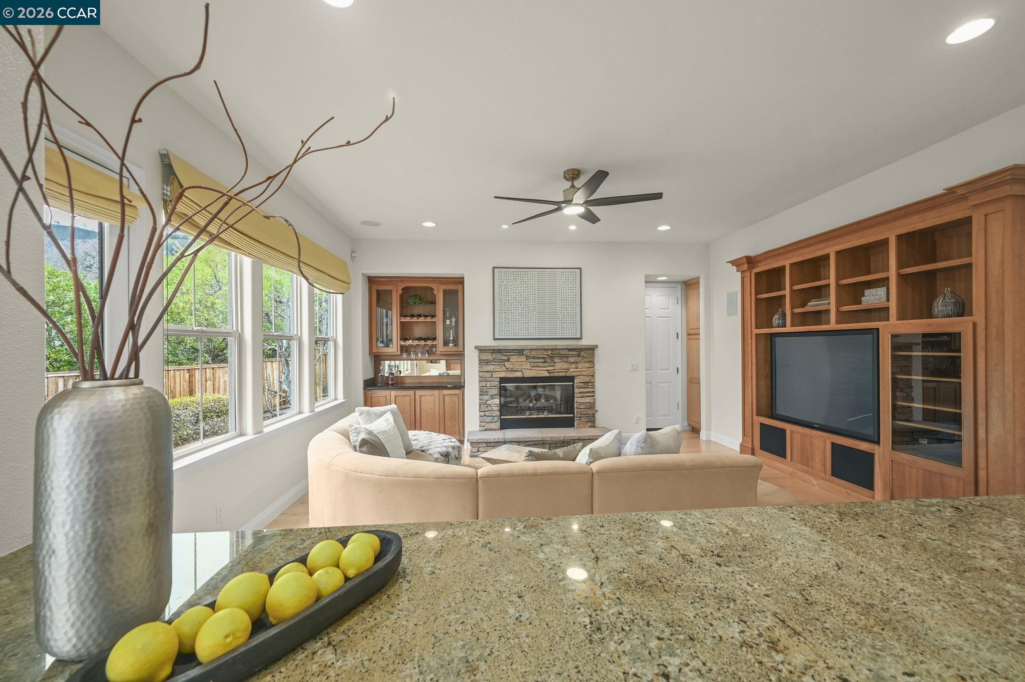135 Diablo Ranch Court Danville, CA 94506 - Photo 25 of 60 a living room with furniture a flat screen tv and a fireplace