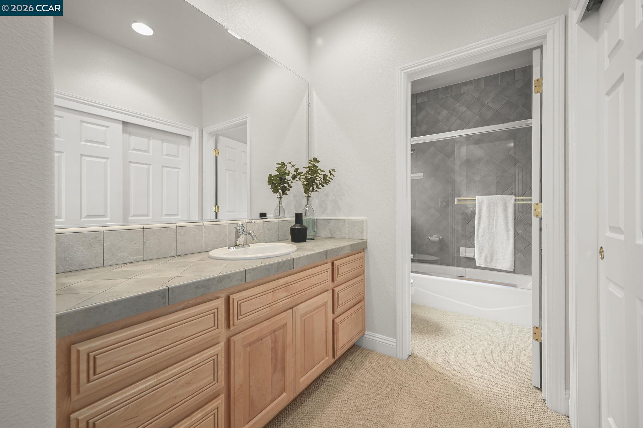 135 Diablo Ranch Court Danville, CA 94506 - Photo 41 of 60 a bathroom with a sink and a mirror