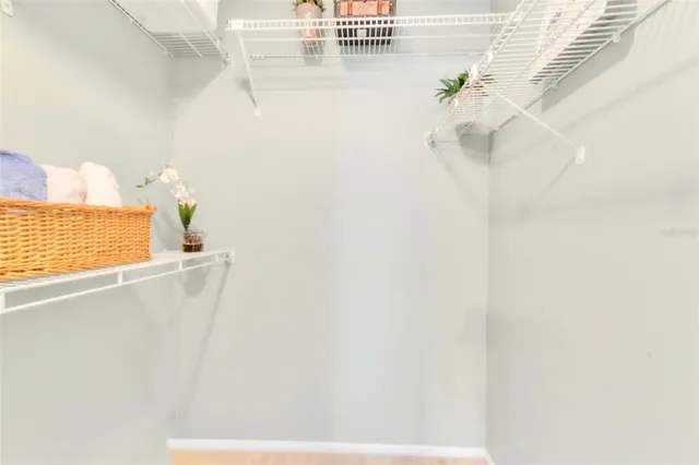 a bathroom with a window and a shower