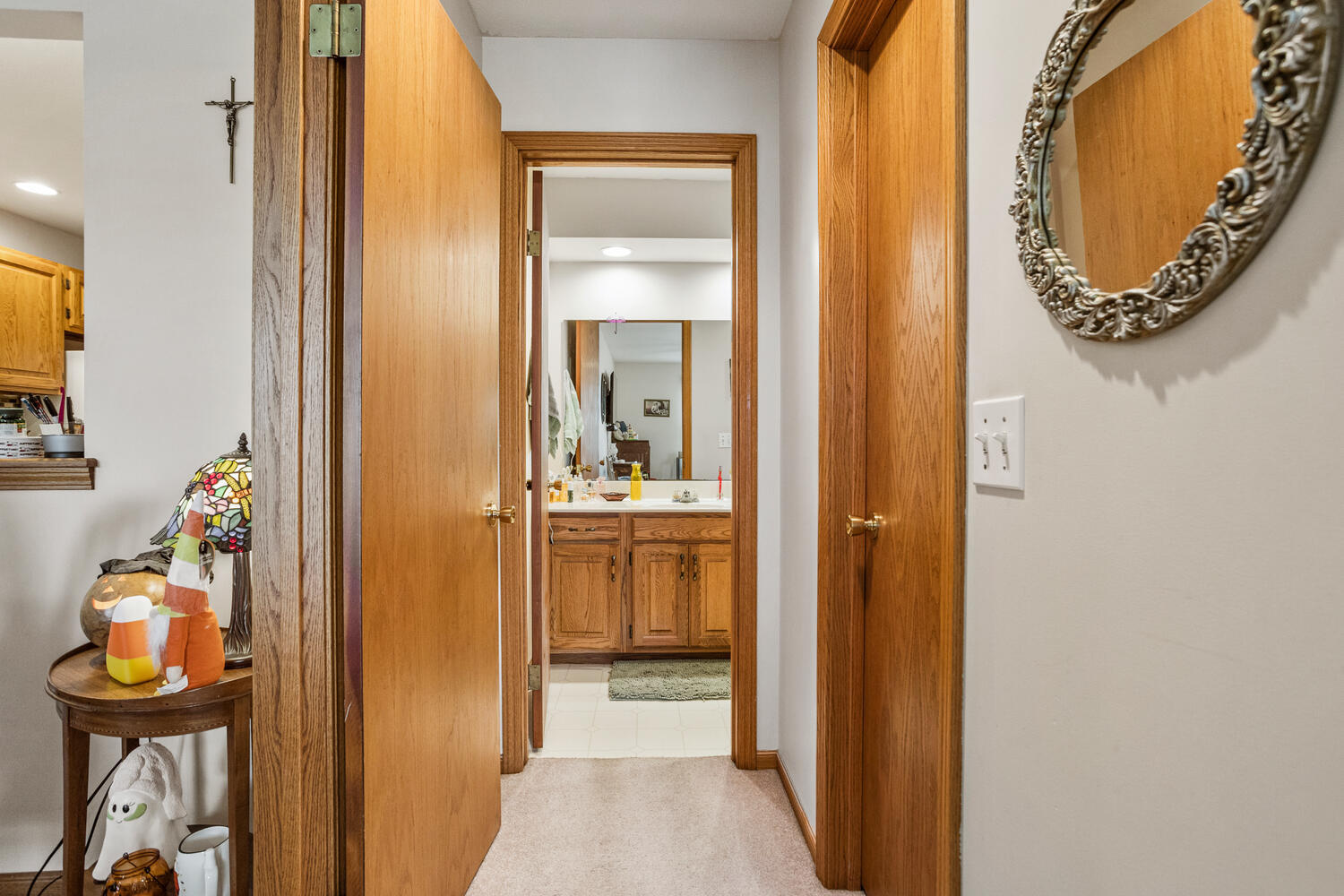 709 Erin Drive Champaign, IL 61822 - Photo 16 of 30 a bathroom with a mirror and a sink