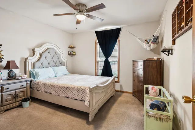 a bed room with a bed and a chandelier