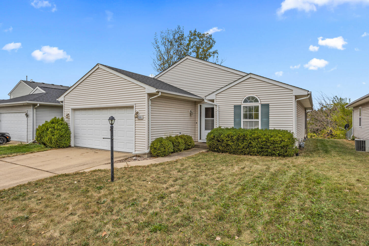 709 Erin Drive Champaign, IL 61822 - Photo 2 of 30 a front view of a house with a yard and garage