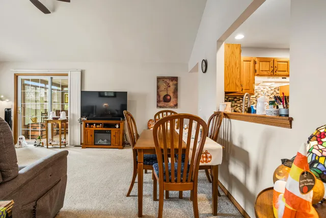 a view of a livingroom with furniture window and a flat screen tv