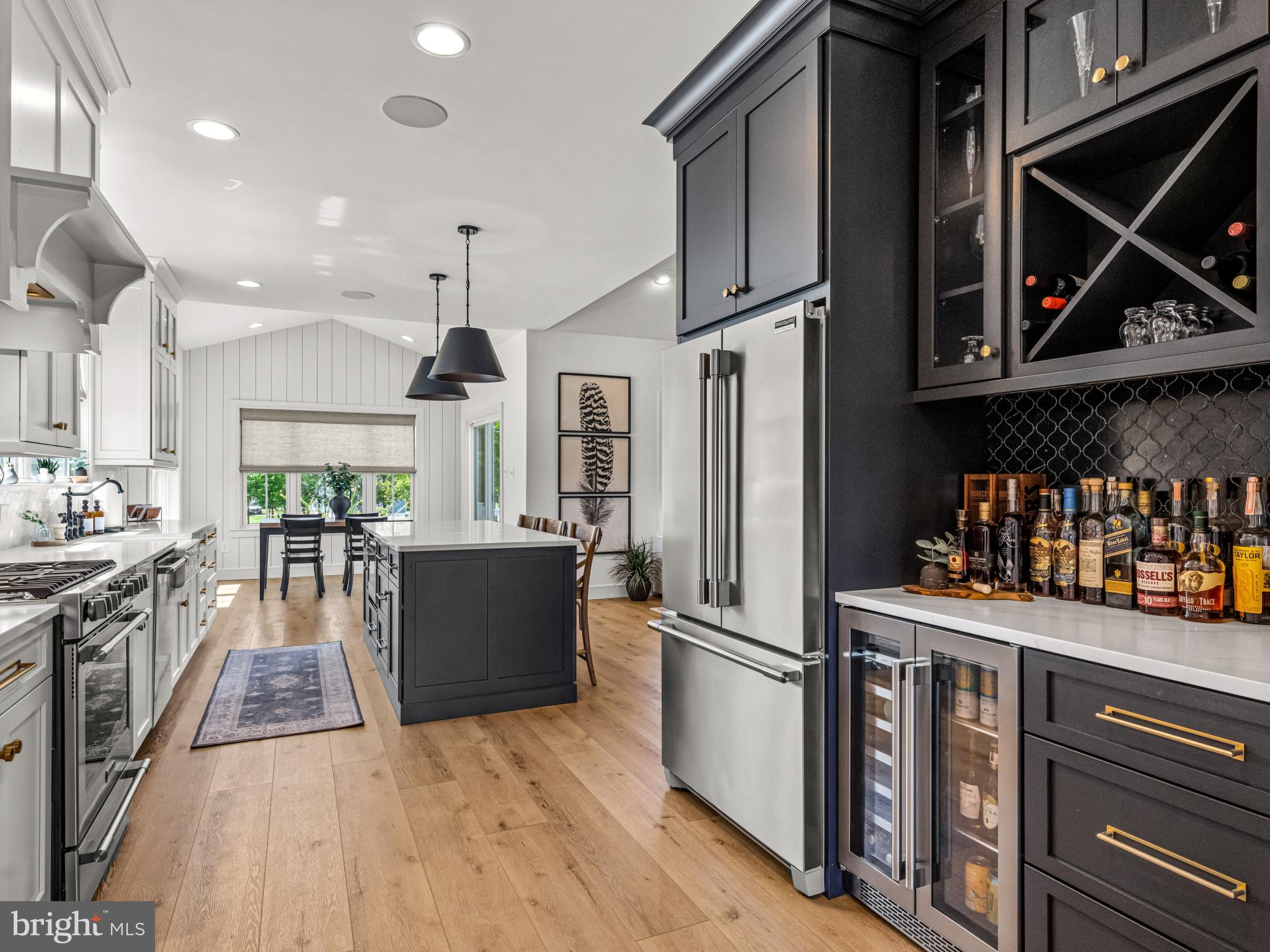 3455 C Durham Road Doylestown, PA 18902 - Photo 15 of 21 a kitchen with stainless steel appliances granite countertop a refrigerator a stove and a wooden floors