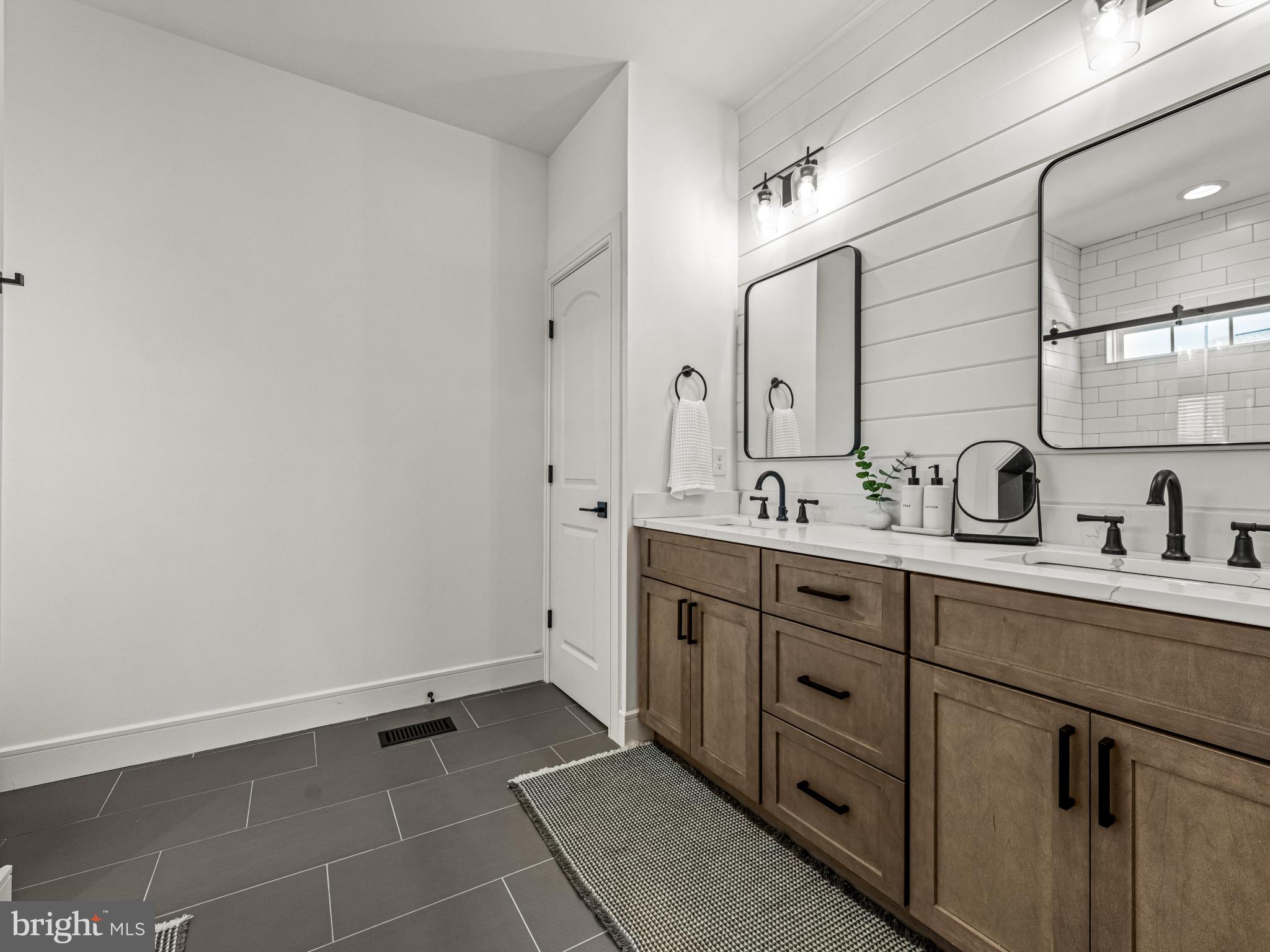 3455 C Durham Road Doylestown, PA 18902 - Photo 18 of 21 a spacious bathroom with a double vanity sink a mirror and with