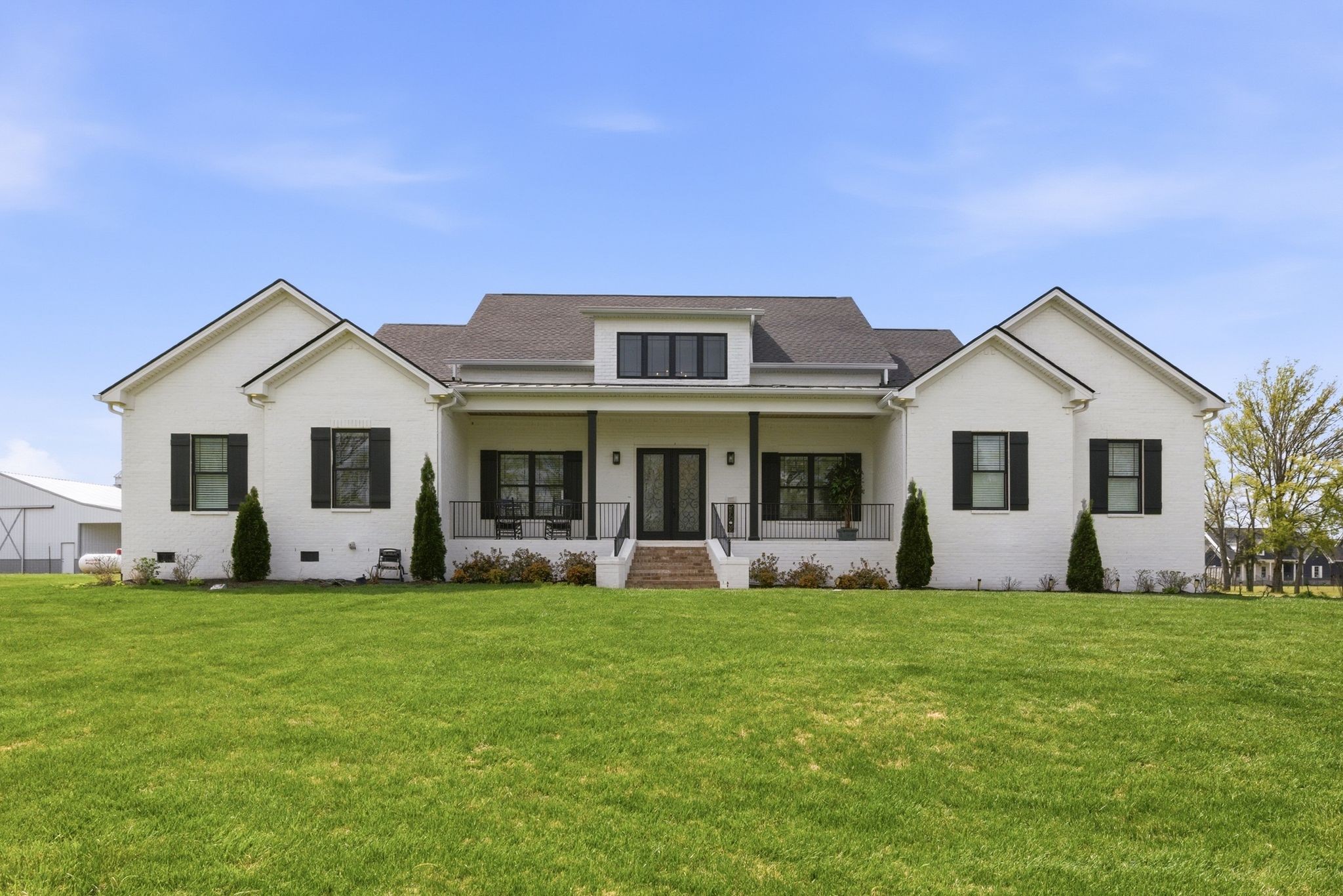 a front view of house with yard and and trees