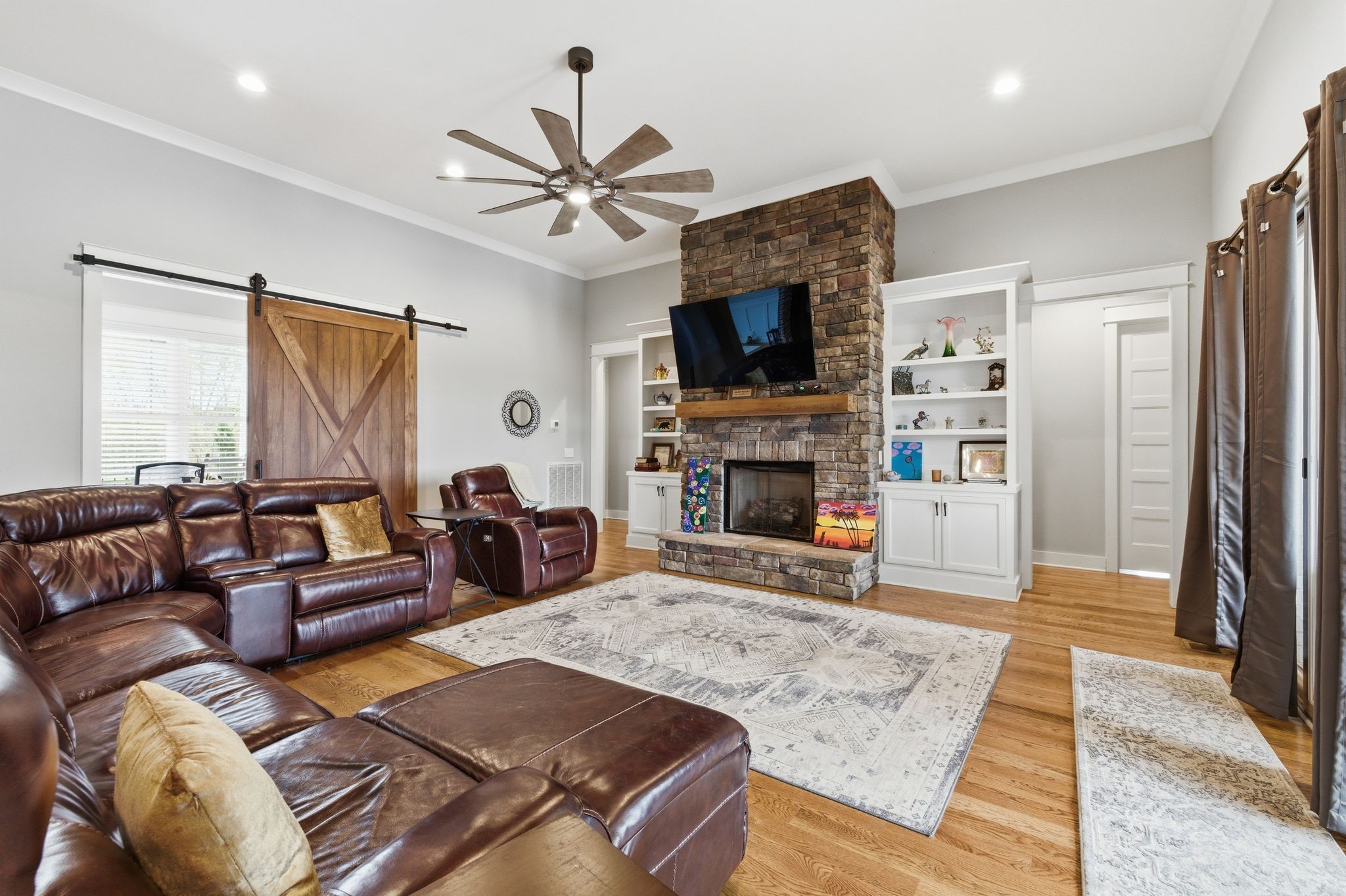 8516 Lowe Christiana Road Christiana, TN 37037 - Photo 14 of 53 a living room with furniture a fireplace and a flat screen tv