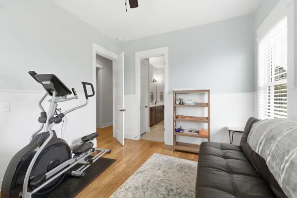 a bedroom with a bed and window