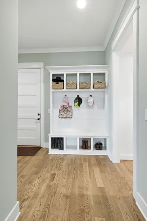 a bedroom with a large bed and a ceiling fan