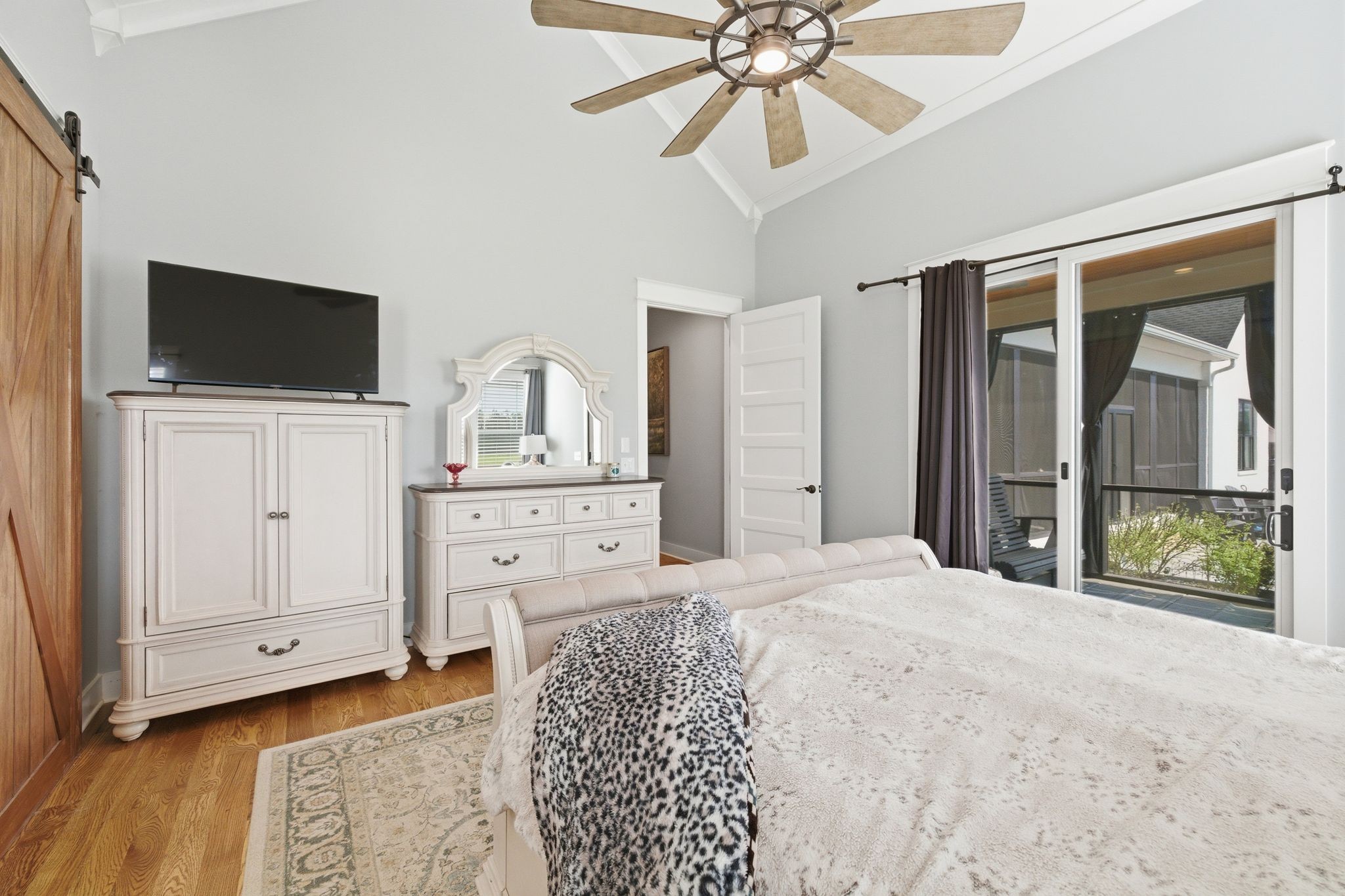8516 Lowe Christiana Road Christiana, TN 37037 - Photo 37 of 53 a bedroom with a bed and a flat screen tv