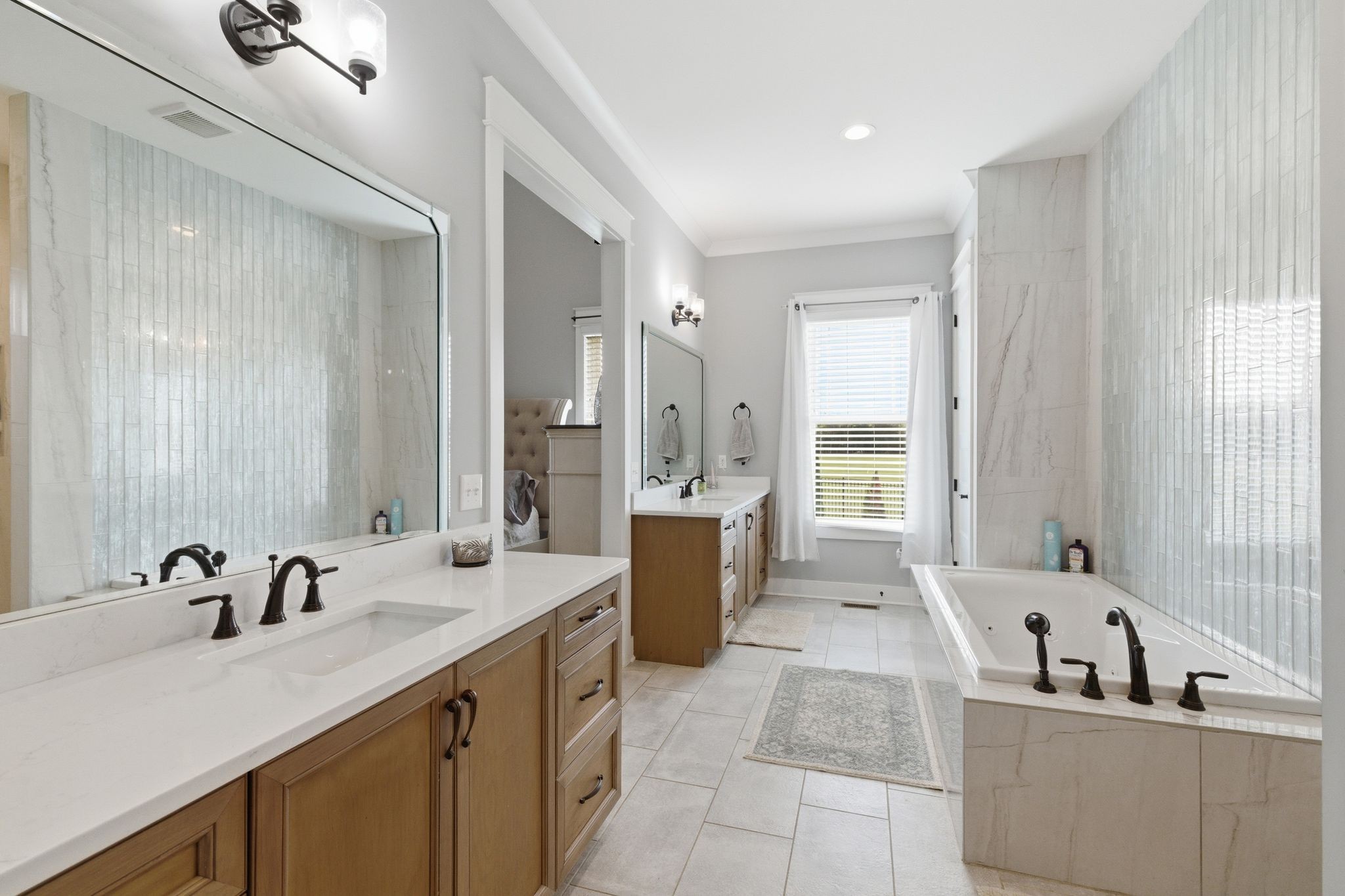 8516 Lowe Christiana Road Christiana, TN 37037 - Photo 39 of 53 a bathroom with a tub sink and mirror