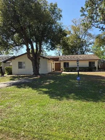 a backyard of a house with lots of green space